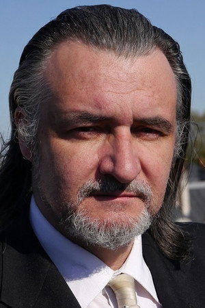 John Arnold profil kép
